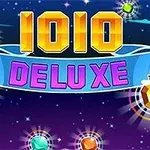 Textul „1010 DELUXE” în culori vibrante pe un fundal cosmic cu planete și stele