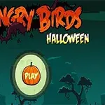 Ecran de start cu tema de Halloween, având un fundal întunecat și un buton portocaliu cu un dovleac și textul Play