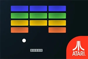 Blocuri colorate aliniate deasupra unei mingi albe și unei platforme, cu sigla Atari în dreapta jos
