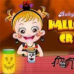 O fetiță zâmbitoare cu părul blond ține un pahar decorat cu motive de Halloween, având lângă ea un păianjen și un felinar sculptat, pe un fundal portocaliu cu text viu colorat