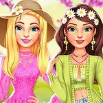 Două personaje feminine animate, una blondă cu pălărie și cealaltă brunetă cu coroană de flori, îmbrăcate în ținute colorate, pe fundal de flori roz