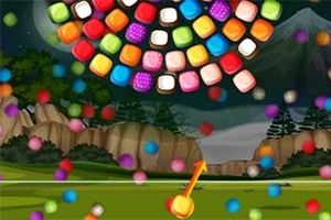 Bile colorate plasate într-o formație de spirală pe un fundal de peisaj montan nocturn, cu copaci și o săgeată care indică către ele