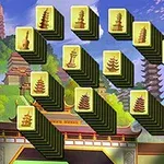 Piese de joc stilizate cu simboluri de pagode și temple, aranjate într-un model geometric pe un fundal cu peisaj tradițional asiatic