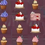 Coco in Cakeland Diverse prăjituri și brioșe colorate așezate în rânduri pe un fundal roz