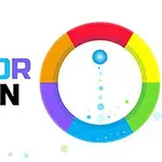 In imagine este un cerc colorat împărțit în patru segmente de culori diferite, cu un text multicolor COLOR SPIN în stânga