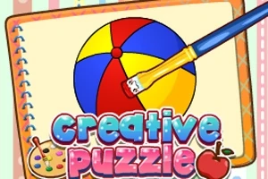 O minge colorată pe un caiet de desen cu o pensulă și cuvintele creative puzzle în partea de jos