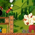 Mașină monstru roșie cu flăcări, rachetă în aer, explozie și personaje mici într-un peisaj verde cu structuri din lemn și cutii