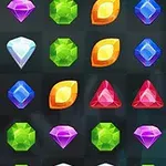 Joc de puzzle cu pietre prețioase colorate, inclusiv diamante, triunghiuri roșii, hexagoane verzi și forme albastru închis, aranjate pe o grilă