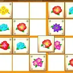 Grilă de pătrate cu imagini colorate de flori variate pe un fundal de lemn