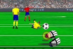 Un jucător de fotbal în echipament galben alunecă spre o minge în timp ce un alt jucător și o pereche de mănuși de portar sunt vizibile pe un teren verde