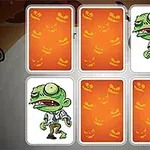 Cinci cărți de joc, două dintre ele dezvăluind imagini ale unui zombie desenat, pe fundal de Halloween cu simboluri de dovleci