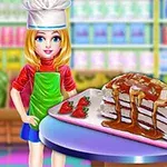 O fată blondă îmbrăcată în haine de bucătar stă lângă un tort cu căpșuni și topping de caramel pe o masă rotundă