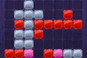 Blocuri colorate albastre, roșii și roz aranjate pe un fundal întunecat, formând o structură geometrică