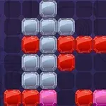 Blocuri colorate albastre, roșii și roz aranjate pe un fundal întunecat, formând o structură geometrică