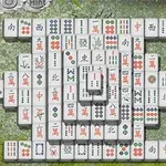 Piese de mahjong aranjate pe o masă de piatră cu un fundal de bambus verde