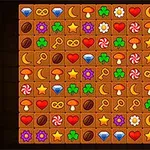 Imaginea prezintă un aranjament de simboluri colorate pe o grilă, inclusiv inimi, stele, ciuperci, diamante și altele