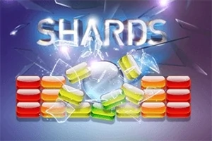 Textul SHARDS împreună cu cărămizi colorate și cioburi de sticlă pe un fundal albastru