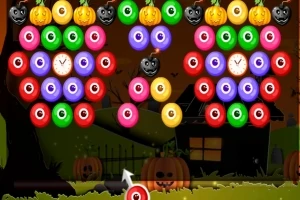 Bile colorate cu fețe de Halloween, inclusiv dovleci și capete de măgăruși, pe un fundal nocturn cu o casă întunecată