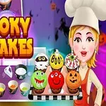 Personaj animat îmbrăcat ca bucătar ținând o tavă cu brioșe decorate în stil de Halloween, alături de textul Spooky Cupcakes pe un fundal colorat