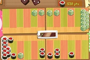 Un aranjament de role de sushi variate pe o suprafață cu dungi colorate, alături de un afișaj digital de puncte