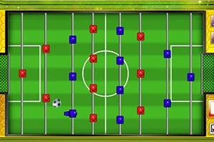 Teren de fotbal de masă cu jucători roșii și albaștri și o minge în mișcare