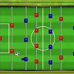 Teren de fotbal de masă cu jucători roșii și albaștri și o minge în mișcare