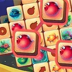 Tabel cu cărămizi ilustrate, având pe ele imagini cu pești, acvarii și alte elemente marine, cu trei cărămizi ce înfățișează pești roșii scoase în evidență