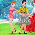 Trei femei îmbrăcate elegant, stând într-un parc luminos, cu rochii colorate și diverse stiluri de coafură